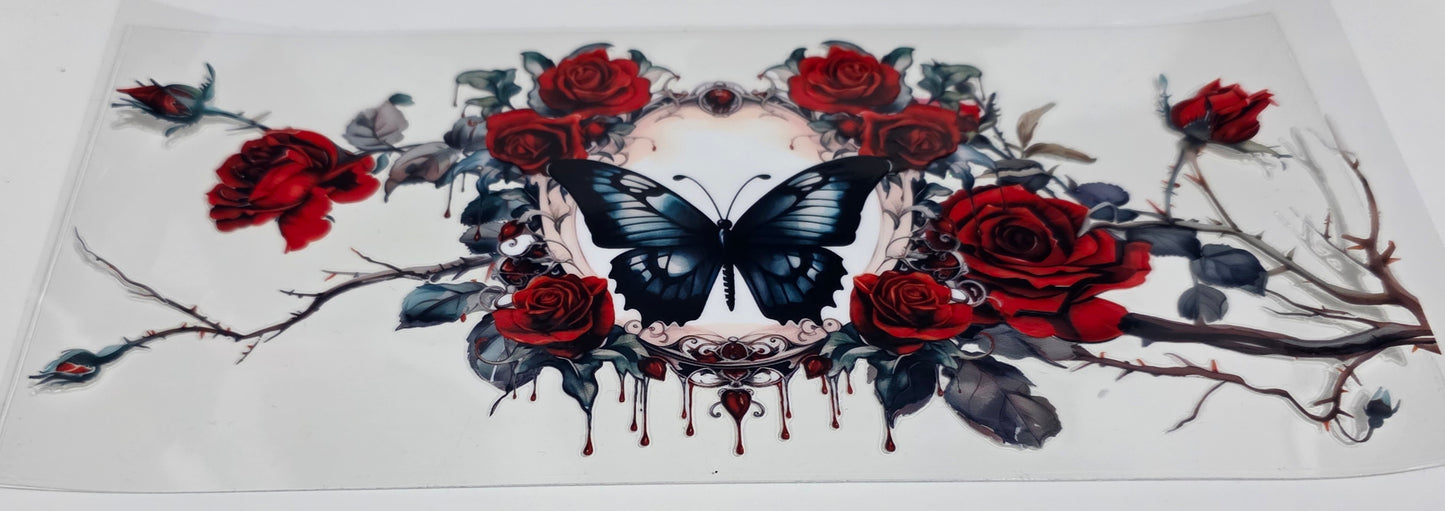 Black butterfly and red roses